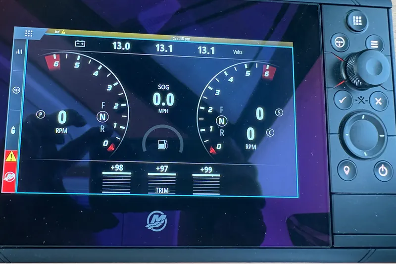 Slide: The Image of Digital dashboard display of a 2025 Back Cove 39O boat showing RPM and voltage. - 34