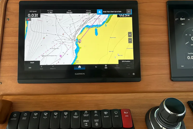 Slide: The Image of Garmin navigation display on 2025 Back Cove 39O boat dashboard. - 37