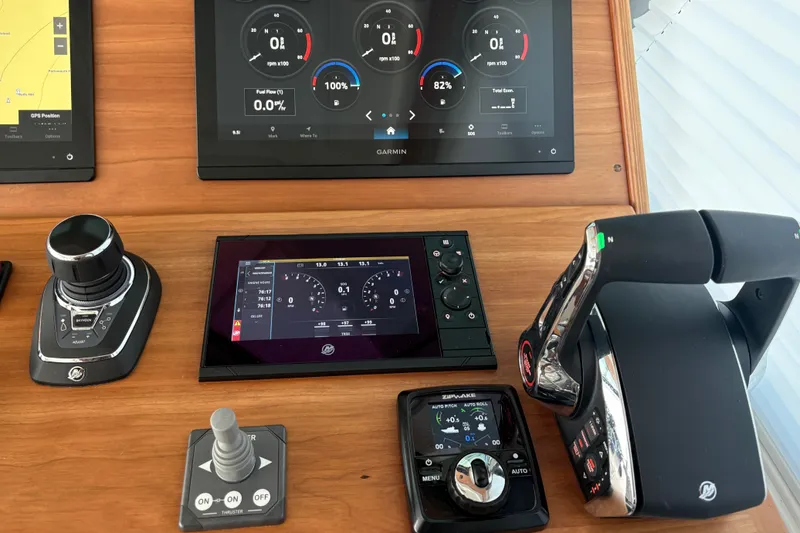 Slide: The Image of Control panel of 2025 Back Cove 39O boat with advanced navigation displays. - 36