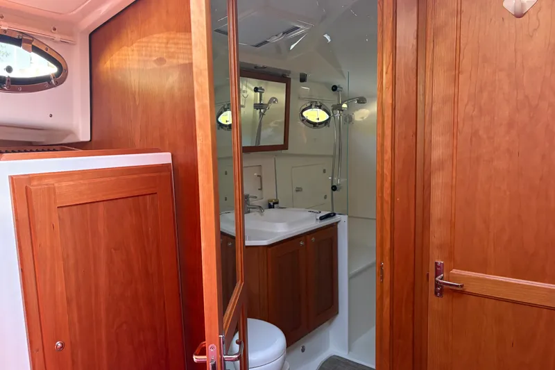 Slide: The Image of Luxurious bathroom interior of 2025 Back Cove 39O yacht with wooden cabinetry. - 13
