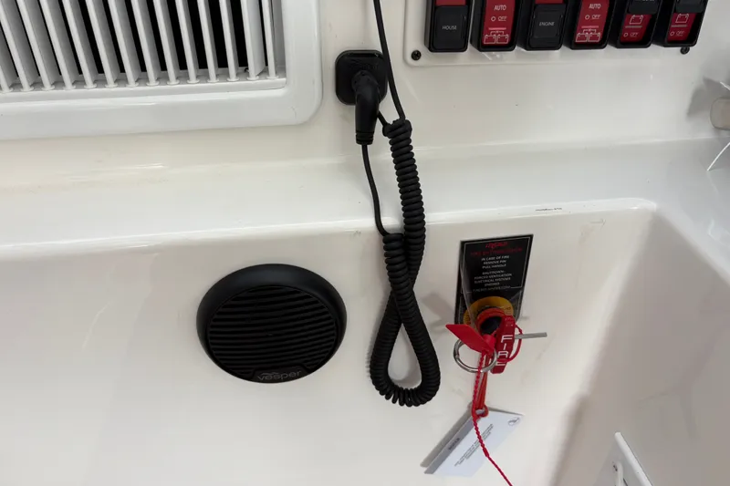 Slide: The Image of Control panel of 2025 Back Cove 39O boat with switches and speaker. - 33