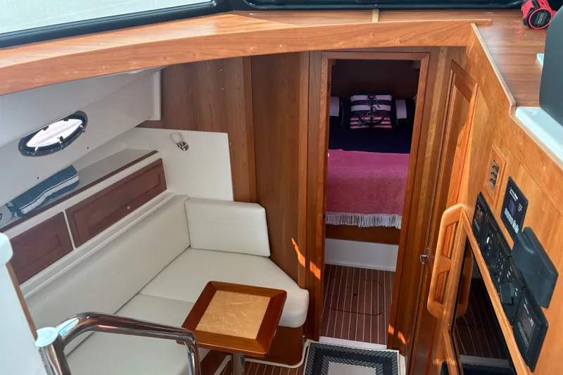 Slide: The Image of Interior of 2025 Back Cove 39O yacht with cozy seating and wooden finishes. - 17