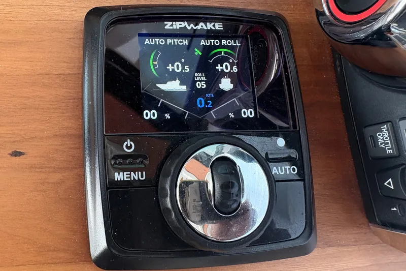 Slide: The Image of Zipwake control panel on 2025 Back Cove 39O boat, displaying auto pitch and roll settings. - 39