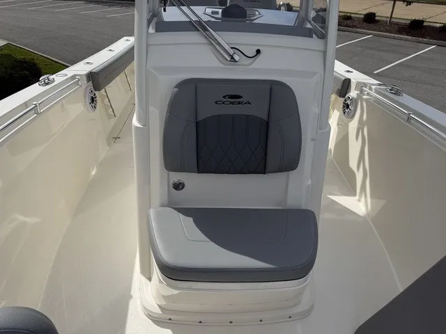 Slide: The Image of The 2024 Cobia 280 Center Console features a sleek seat with gray upholstery. - 27