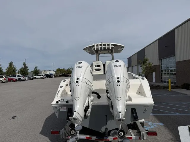 Slide: The Image of The image shows a 2024 Cobia 280 Center Console boat with two outboard engines. - 6