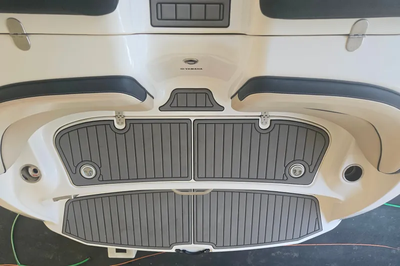 Slide: The Image of 2013 Yamaha Boats AR240 HO swim platform with gray non-slip mats and sleek design. - 11