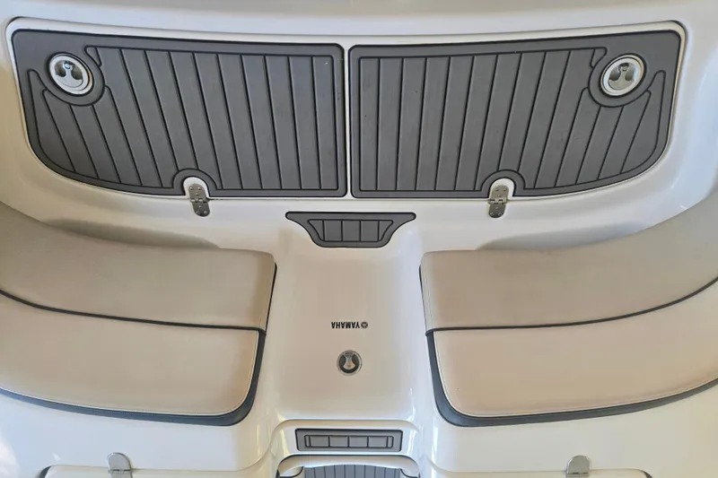 Slide: The Image of 2013 Yamaha Boats AR240 HO swim platform with cushioned seating and storage compartments. - 3