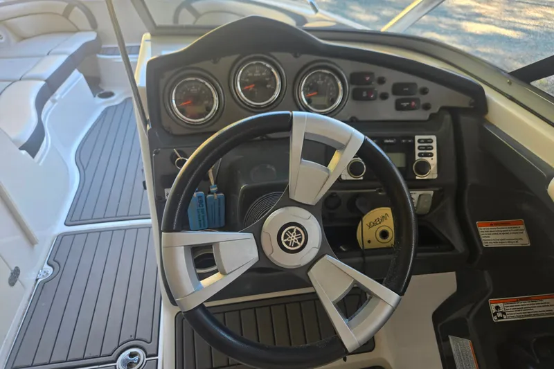 Slide: The Image of 2013 Yamaha Boats AR240 HO dashboard with steering wheel and instrument panel. - 8