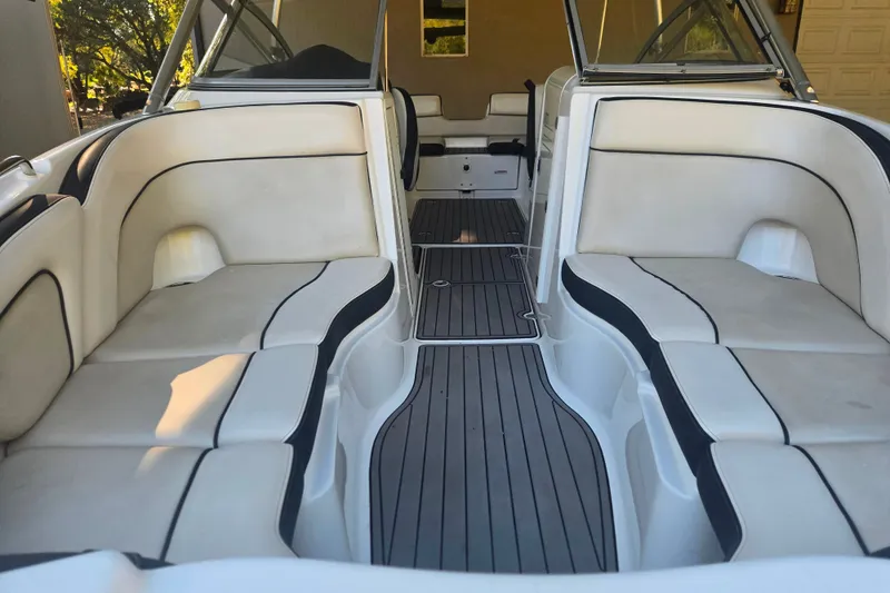 Slide: The Image of 2013 Yamaha Boats AR240 HO interior with spacious seating and sleek design. - 6