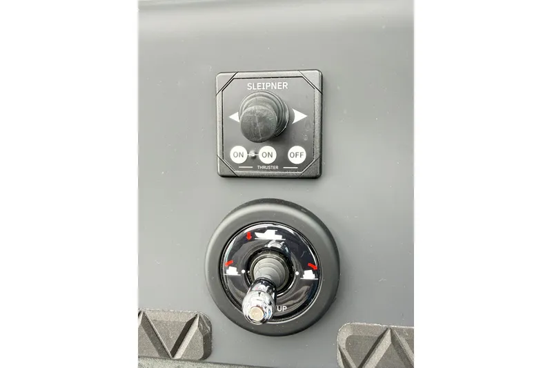 Slide: The Image of Control panel of 2025 Axopar 37 XC Cross Cabin with Sleipner thruster switch. - 26