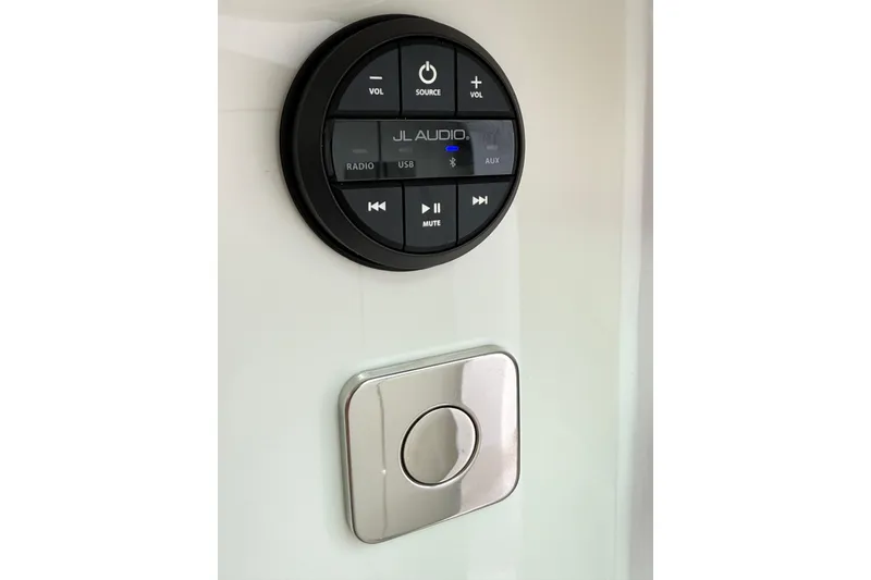 Slide: The Image of Audio control panel on 2025 Axopar 37 XC Cross Cabin boat interior. - 32