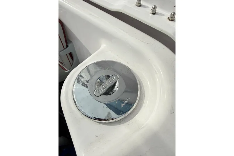 Slide: The Image of Chrome water cap on 2025 Axopar 37 XC Cross Cabin boat deck. - 47