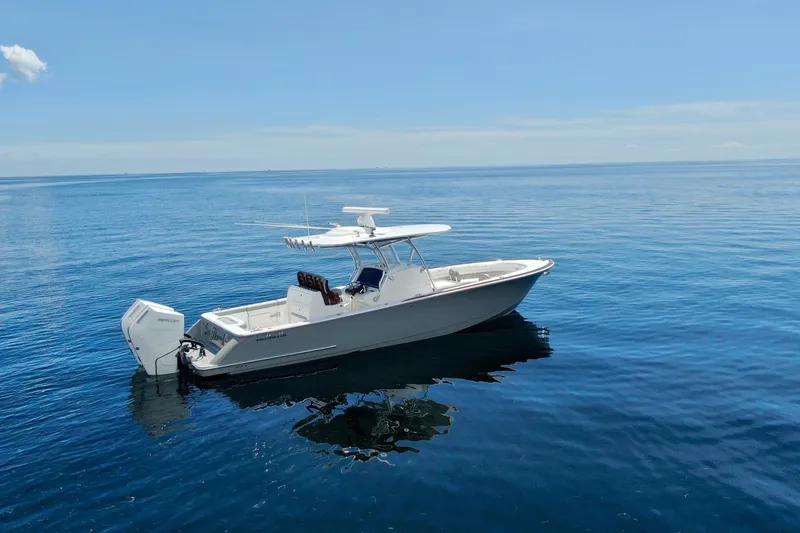 Slide: The Image of 2024 Valhalla V-33 boat on calm blue ocean under clear sky. - 1