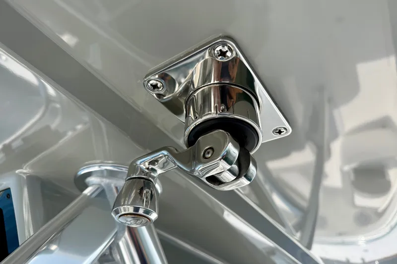 Slide: The Image of Close-up of a chrome fitting on a 2024 Valhalla V-33 boat. - 33