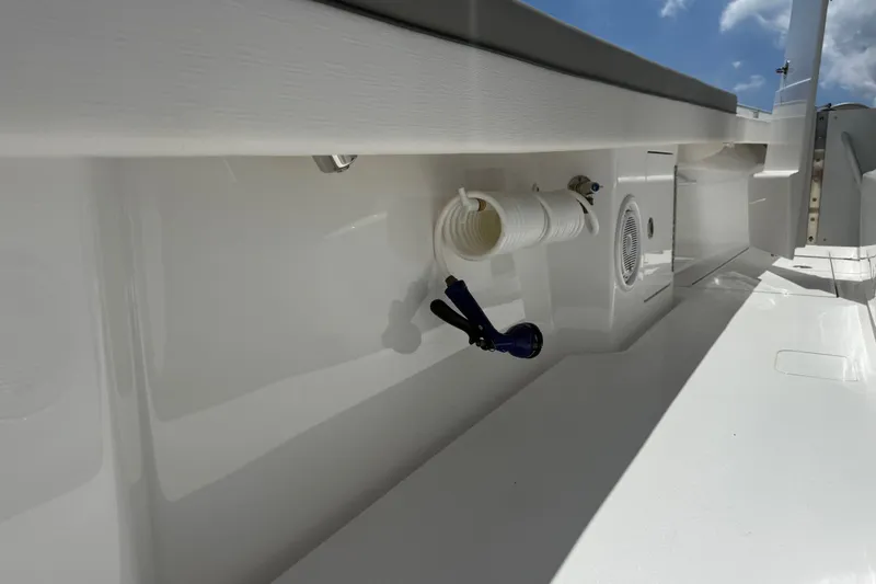 Slide: The Image of 2024 Valhalla V-33 boat interior with coiled hose and speaker detail. - 14