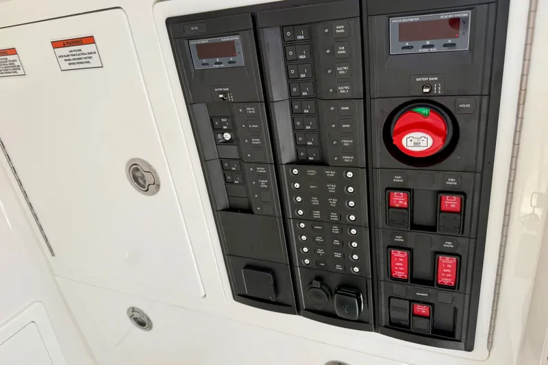 Slide: The Image of Electrical control panel of 2024 Valhalla V-33 boat with switches and indicators. - 38