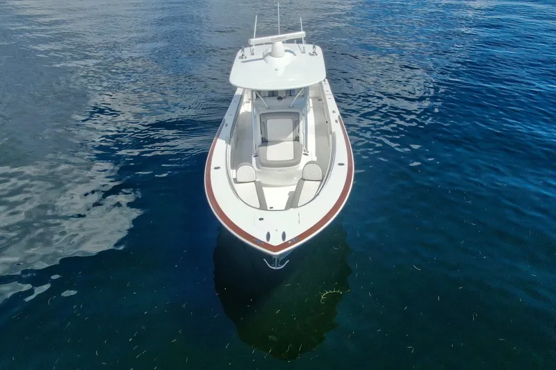 Slide: The Image of 2024 Valhalla V-33 boat on calm blue water, aerial view. - 6
