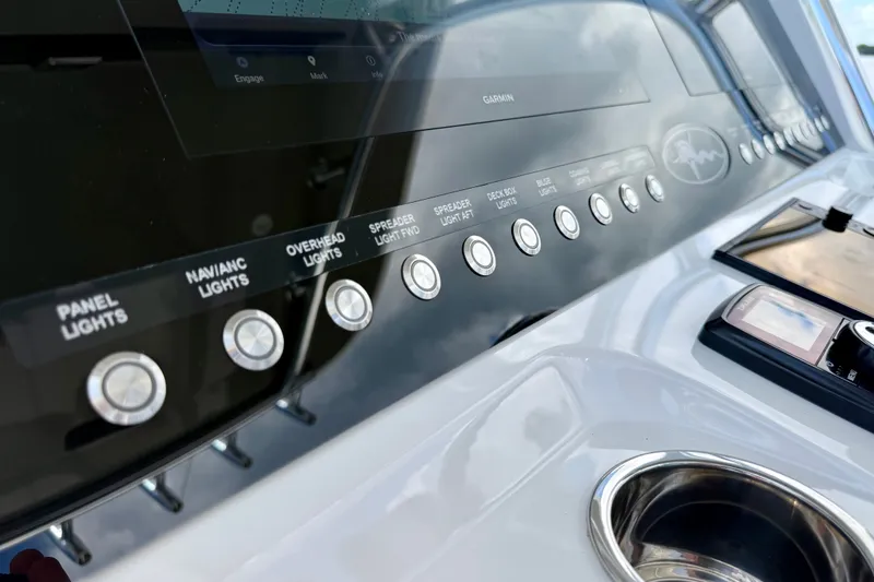 Slide: The Image of Control panel of 2024 Valhalla V-33 boat with labeled buttons and display. - 21