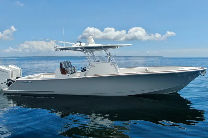 Slide: The Image of 2024 Valhalla V-33 boat on calm ocean with clear blue sky. - 10