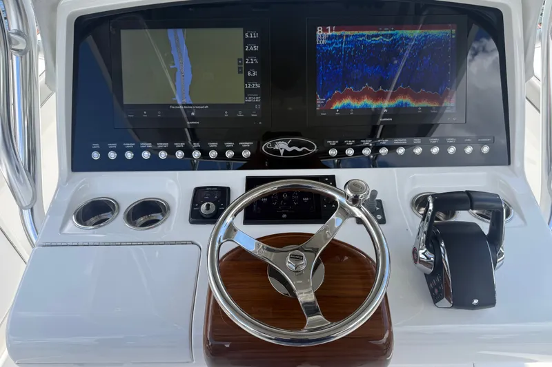 Slide: The Image of 2024 Valhalla V-33 boat dashboard with advanced navigation and control systems. - 20