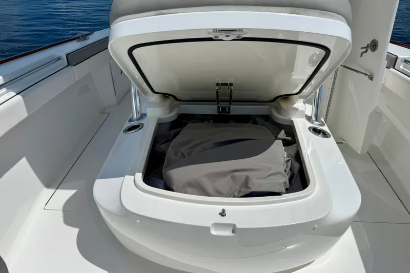 Slide: The Image of Open storage compartment on 2024 Valhalla V-33 boat, showcasing spacious interior design. - 37