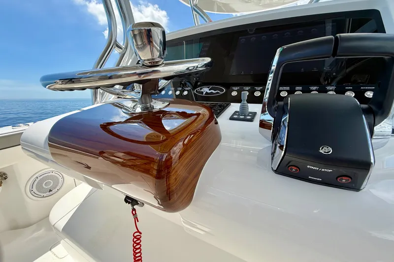 Slide: The Image of 2024 Valhalla V-33 helm with polished wood and modern controls, ocean backdrop. - 23