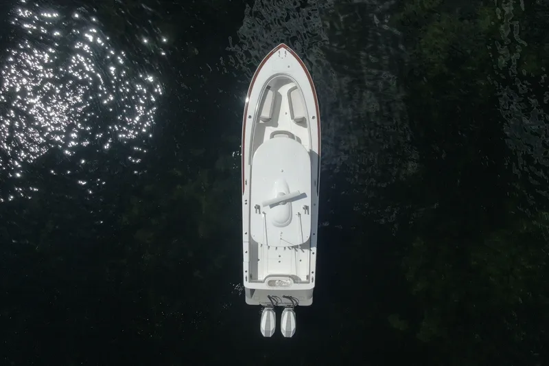 Slide: The Image of Overhead view of 2024 Valhalla V-33 boat on dark water with sunlight reflections. - 12