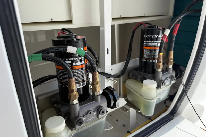 Slide: The Image of 2024 Valhalla V-33 hydraulic steering pumps in engine compartment. - 27