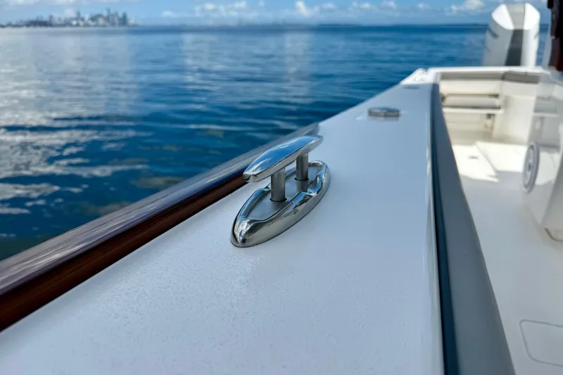 Slide: The Image of 2024 Valhalla V-33 boat detail with ocean view in the background. - 32