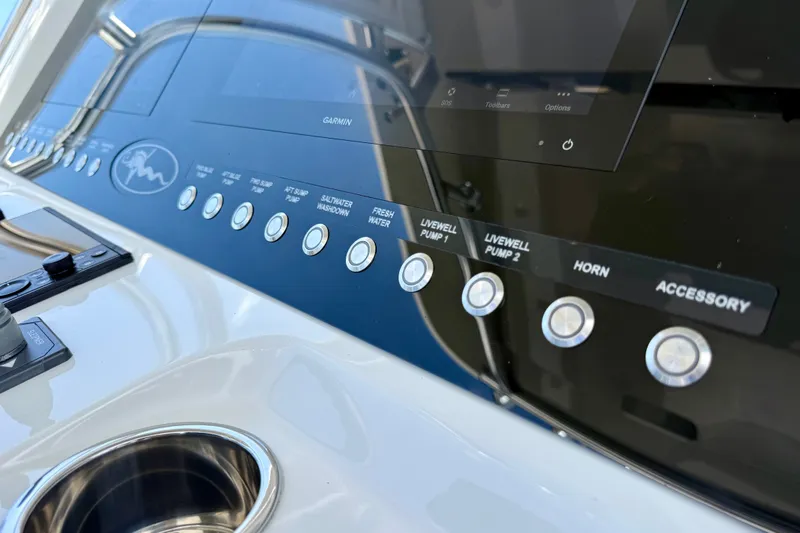 Slide: The Image of Control panel of 2024 Valhalla V-33 boat with labeled buttons and touchscreen display. - 24