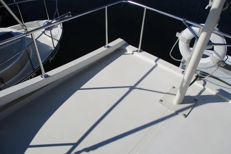 Slide: The Image of 2005 Camano 31 Troll boat deck with railing and life preserver. - 28