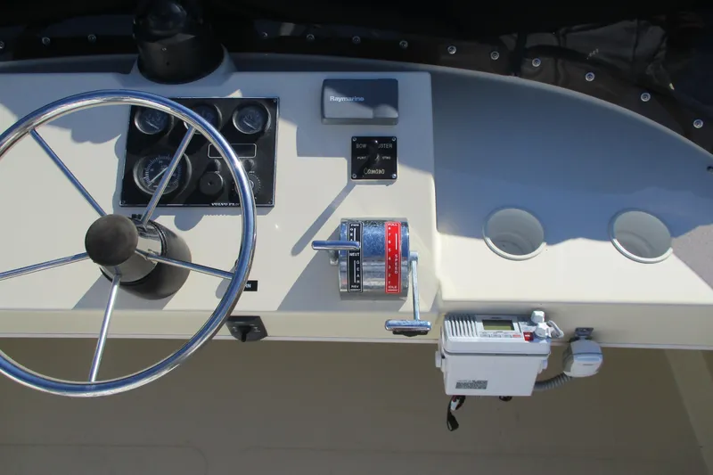 Slide: The Image of Helm of 2005 Camano 31 Troll boat with steering wheel and control panel. - 21