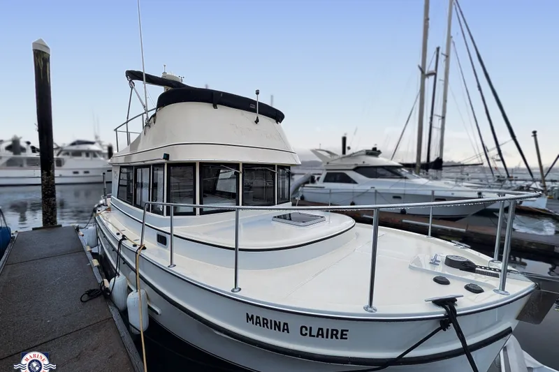 The Image of 2005 Camano 31 Troll boat named "Marina Claire" docked at a marina. - 0