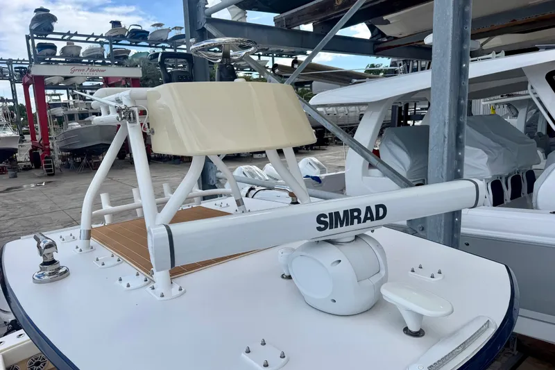 Slide: The Image of 2021 Conch 33 boat with Simrad radar, docked in a marina. - 16