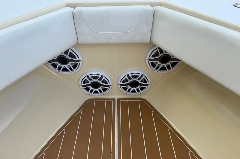 Slide: The Image of Interior of 2021 Conch 33 boat with speakers and cushioned seating. - 11