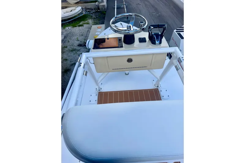 Slide: The Image of 2021 Conch 33 boat helm with steering wheel and controls. - 26