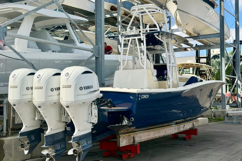 Slide: The Image of 2021 Conch 33 boat with triple Yamaha 300 engines in storage. - 3
