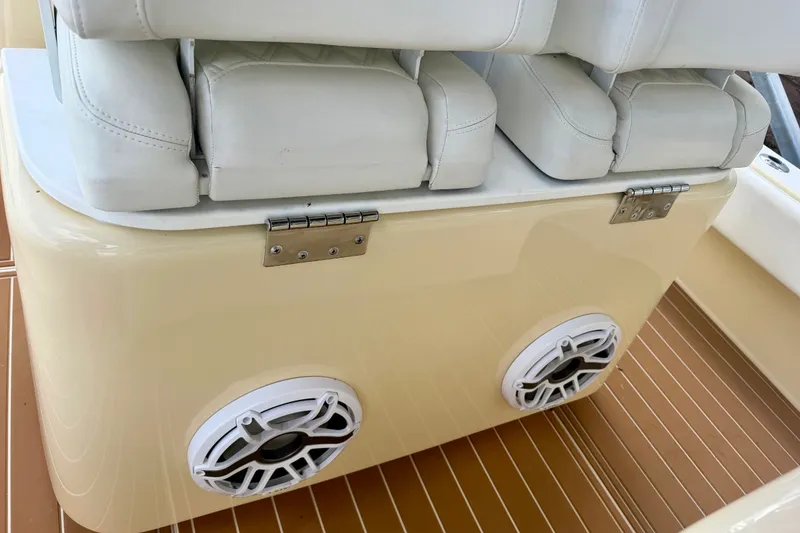 Slide: The Image of 2021 Conch 33 boat seating with white cushions and dual speakers. - 20