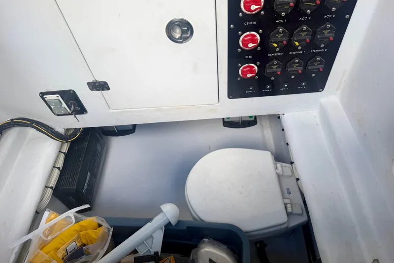 Slide: The Image of Interior of a 2021 Conch 33 boat showing control panel and storage area. - 31