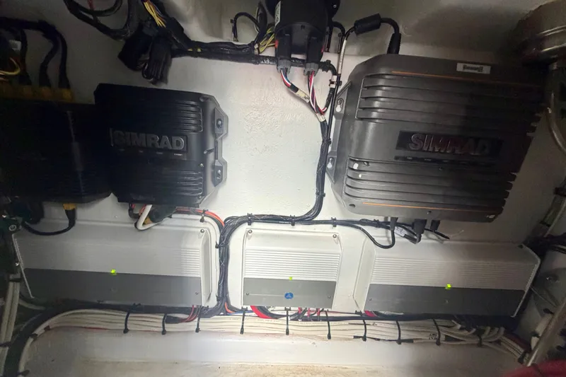 Slide: The Image of Electrical components and wiring inside a 2021 Conch 33 boat. - 36
