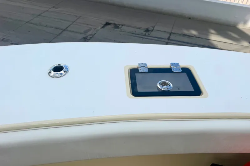 Slide: The Image of 2021 Conch 33 boat deck with hatch and metal fitting. - 27