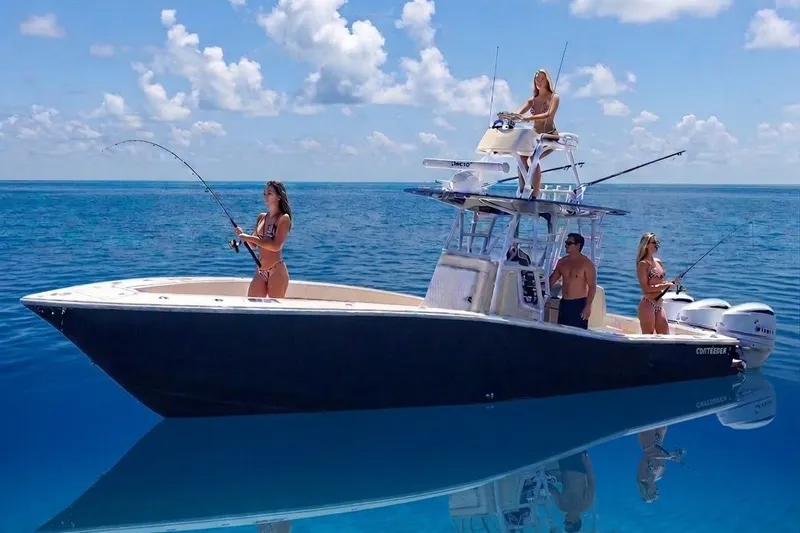 The Image of 2021 Conch 33 boat with people fishing on a clear blue ocean. - 1