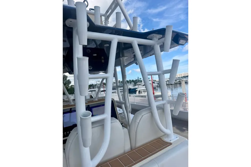 Slide: The Image of 2021 Conch 33 boat with rod holders and seating, docked at marina. - 17