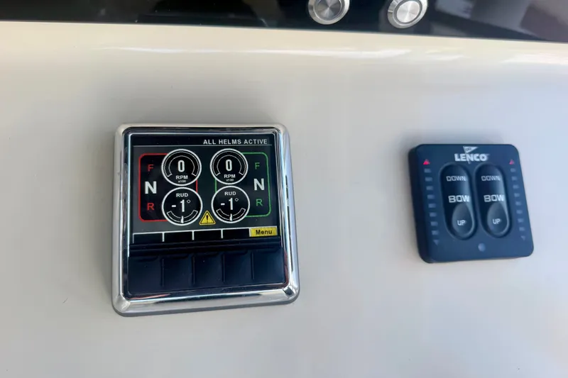 Slide: The Image of Control panel of a 2021 Conch 33 boat with Lenco trim tab switches. - 23
