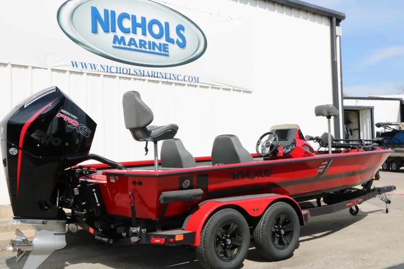 Slide: The Image of A red Vexus AVX 2080 boat from 2027 on a trailer in front of a building. - 11
