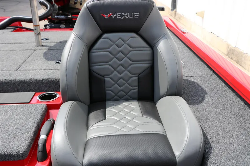 Slide: The Image of A gray and black seat with Vexus logo on a red boat. - 35