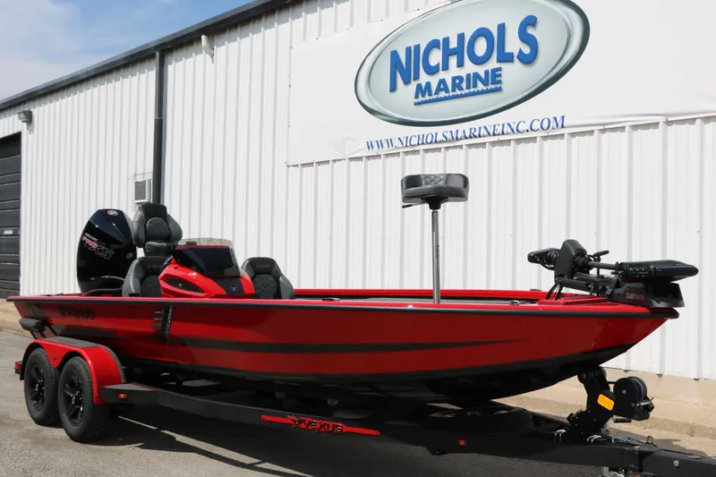 Slide: The Image of A red 2027 Vexus AVX 2080 boat on a trailer in front of a building. - 6
