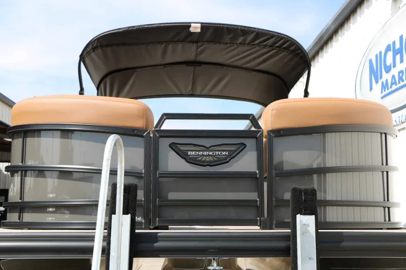 Slide: The Image of The image shows the rear of a Bennington 24 MSL Tri Toon boat with a black sunshade. - 9