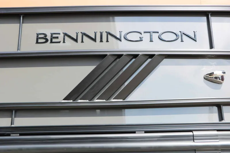 Slide: The Image of Close-up of the Bennington logo on a 2027 24 MSL Tri Toon. - 26