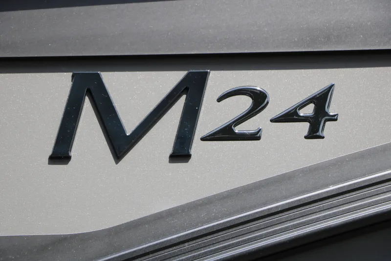 Slide: The Image of Close-up of the "M24" lettering on a Bennington 24 MSL Tri Toon boat. - 27